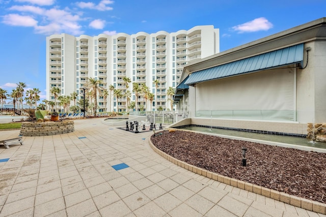 view of home's community with a patio area