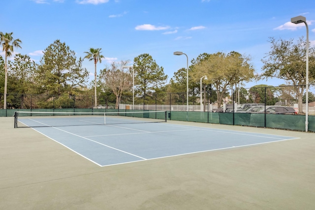 view of tennis court featuring basketball court