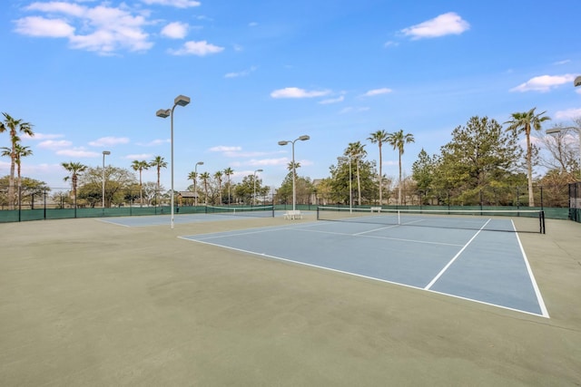 view of sport court with basketball hoop