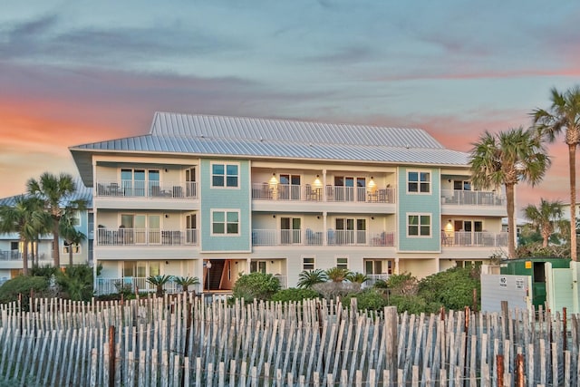 view of outdoor building at dusk