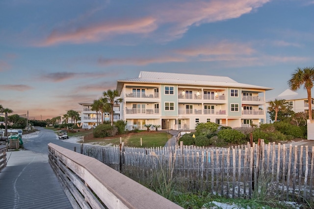 view of outdoor building at dusk