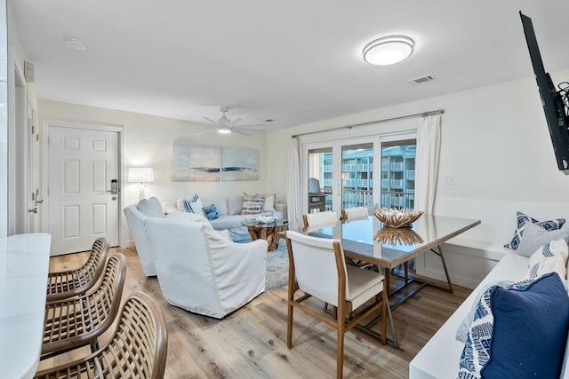 dining area featuring ceiling fan and light hardwood / wood-style flooring