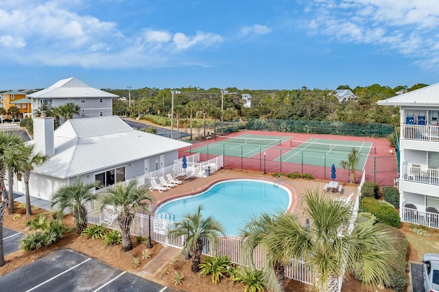 view of pool featuring tennis court