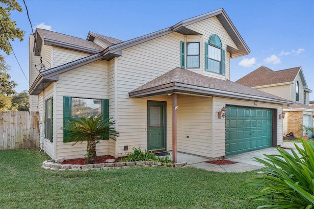 view of front of property featuring a front yard and a garage