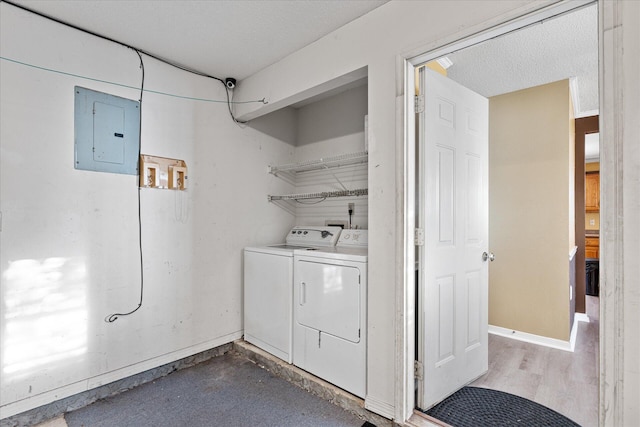 laundry area with separate washer and dryer and electric panel