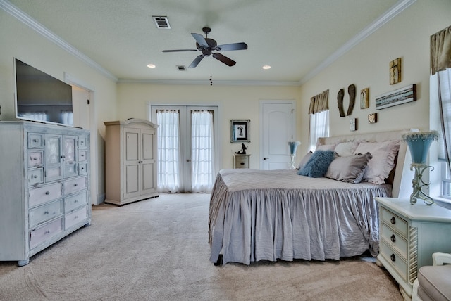 bedroom with ceiling fan, french doors, crown molding, and light carpet