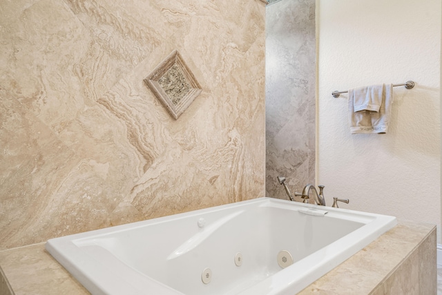 bathroom with tiled tub