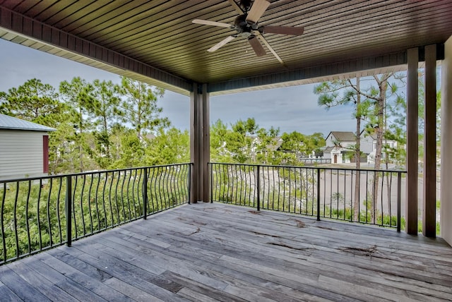 wooden terrace featuring ceiling fan