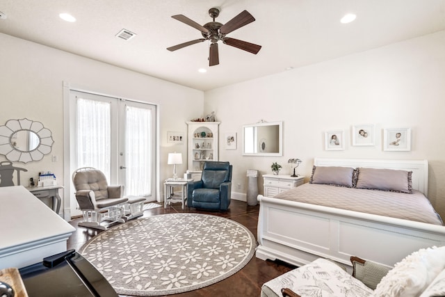 bedroom featuring ceiling fan, dark hardwood / wood-style flooring, and french doors