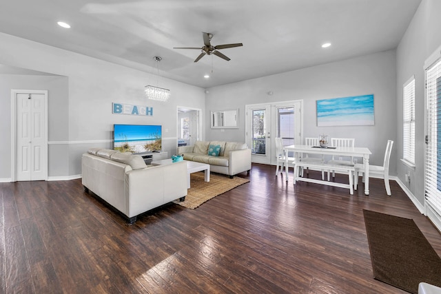 living room featuring ceiling fan, dark hardwood / wood-style flooring, and french doors