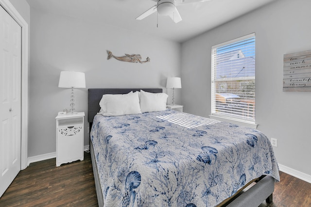 bedroom with a closet, dark hardwood / wood-style floors, and ceiling fan