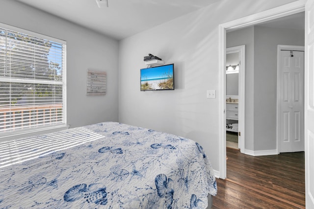 bedroom featuring dark hardwood / wood-style flooring