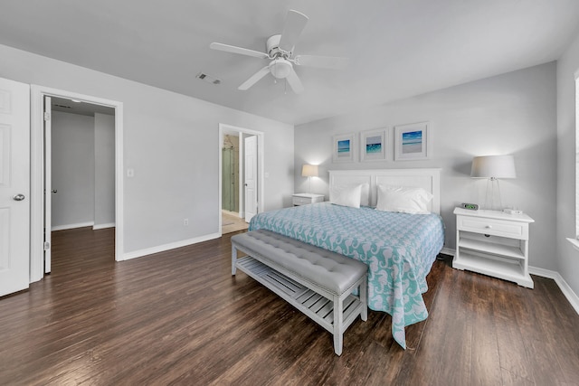 bedroom featuring ensuite bath, ceiling fan, and dark wood-type flooring