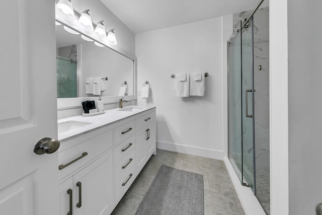 bathroom with vanity, tile patterned floors, and walk in shower