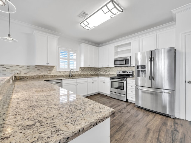 kitchen featuring light stone countertops, stainless steel appliances, dark hardwood / wood-style flooring, decorative light fixtures, and white cabinets