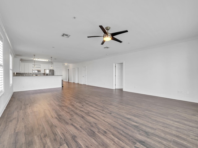 unfurnished living room with ornamental molding, ceiling fan, and dark wood-type flooring