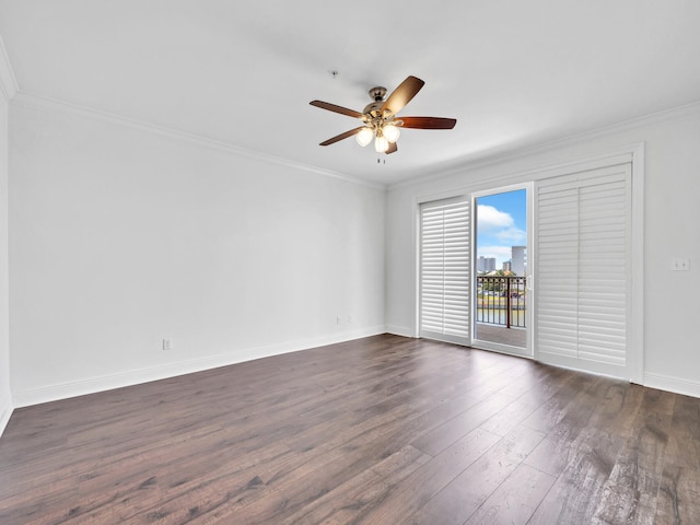 spare room with dark hardwood / wood-style flooring, ceiling fan, and ornamental molding