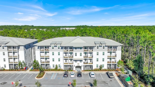 179 S County Highway 393 # 324, Santa Rosa Beach, FL 32459 - view of apartment building / complex with a forest view and uncovered parking
