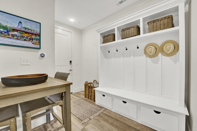 mudroom with hardwood / wood-style flooring