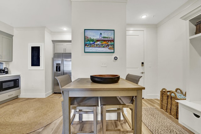 dining room with light hardwood / wood-style flooring