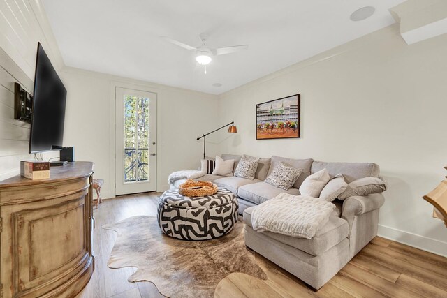 179 S County Highway 393 # 324, Santa Rosa Beach, FL 32459 - living room featuring ceiling fan, light wood finished floors, baseboards, and ornamental molding