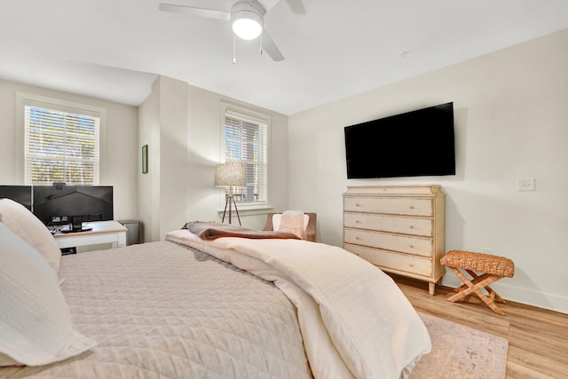 bedroom featuring light hardwood / wood-style flooring and ceiling fan