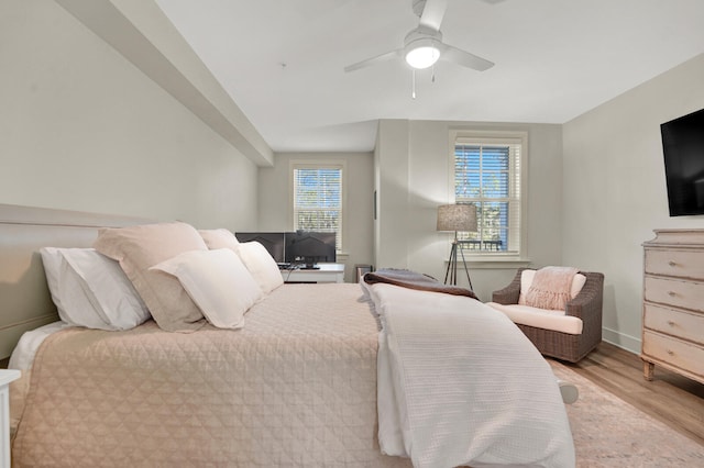 bedroom with light wood-type flooring and ceiling fan