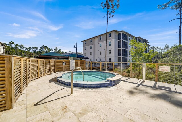 view of pool featuring a hot tub