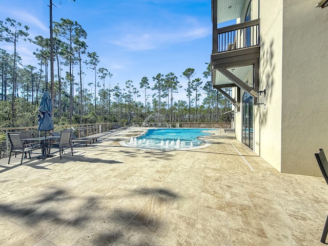 view of swimming pool featuring a patio