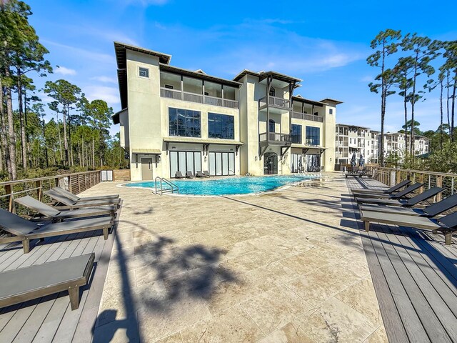 179 S County Highway 393 # 324, Santa Rosa Beach, FL 32459 - community pool featuring a patio