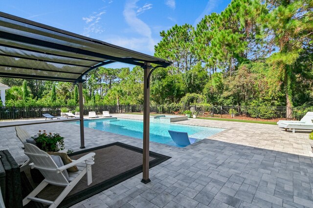 view of swimming pool featuring a pergola and a patio area