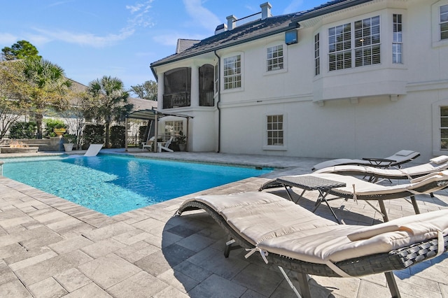 view of swimming pool with a patio