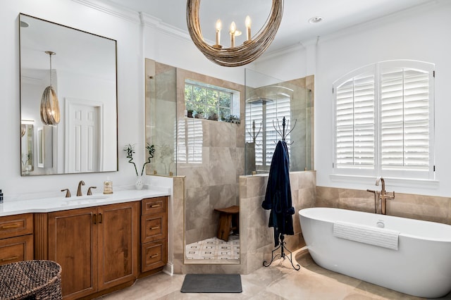 bathroom with vanity, tile patterned flooring, ornamental molding, shower with separate bathtub, and a notable chandelier