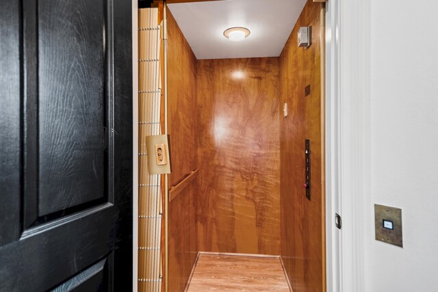 interior details with elevator and wooden walls