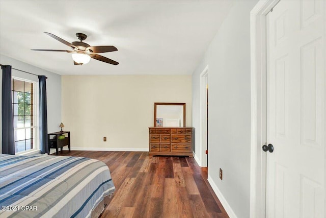 bedroom featuring ceiling fan and dark hardwood / wood-style floors