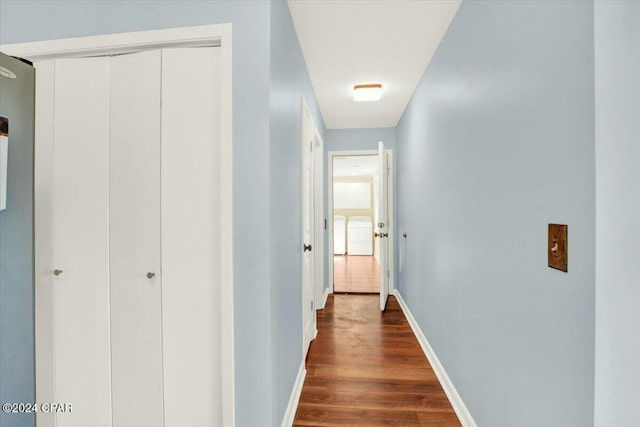 hallway with dark wood-type flooring