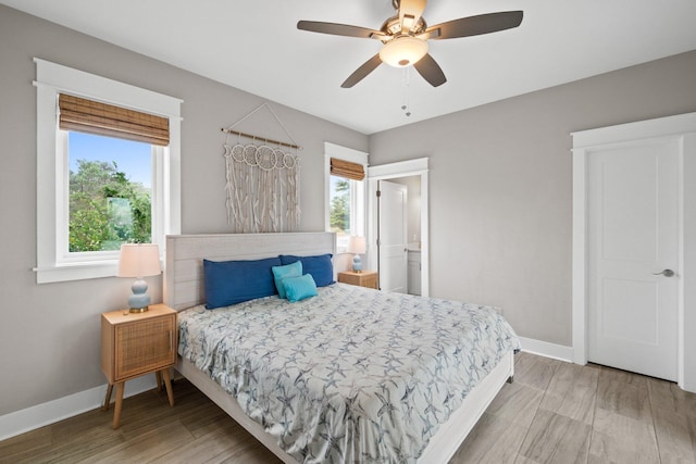 bedroom featuring wood-type flooring and ceiling fan