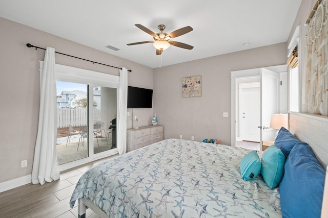 bedroom featuring access to exterior, light wood-type flooring, and ceiling fan