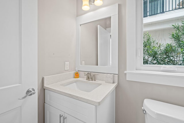 bathroom featuring vanity and toilet