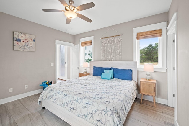 bedroom with ceiling fan and light hardwood / wood-style floors