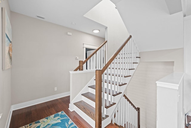 stairway featuring hardwood / wood-style floors