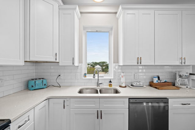 kitchen with dishwasher, white cabinets, and sink