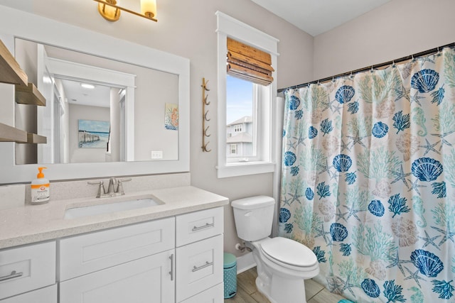 bathroom featuring hardwood / wood-style floors, vanity, toilet, and a shower with curtain