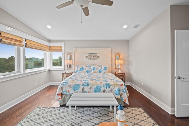 bedroom with ceiling fan, dark hardwood / wood-style flooring, and lofted ceiling