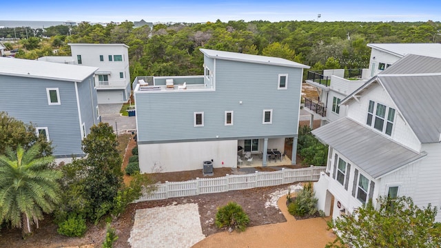 rear view of property featuring central AC unit