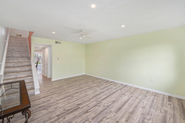 empty room with light wood-type flooring and ceiling fan