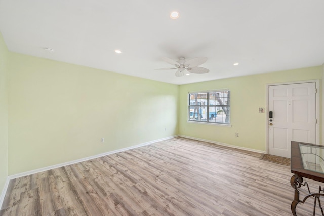 interior space with light wood-type flooring and ceiling fan