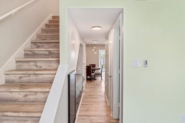 staircase featuring wood-type flooring