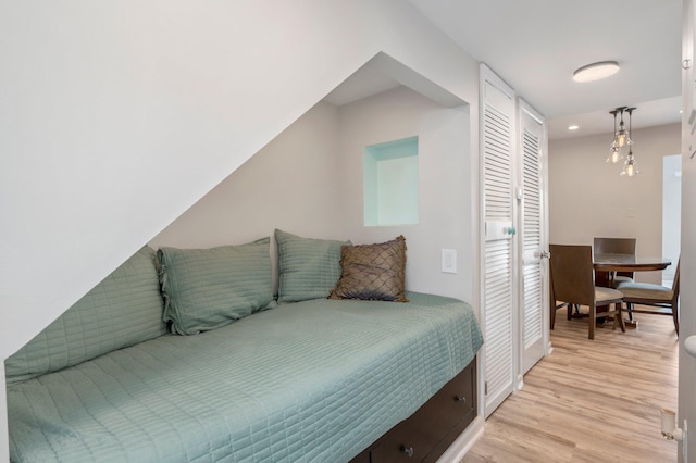 bedroom featuring a closet and light hardwood / wood-style floors