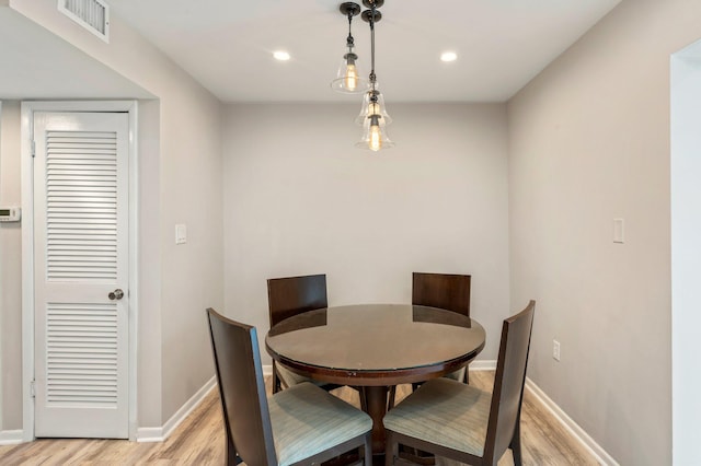 dining space with light wood-type flooring